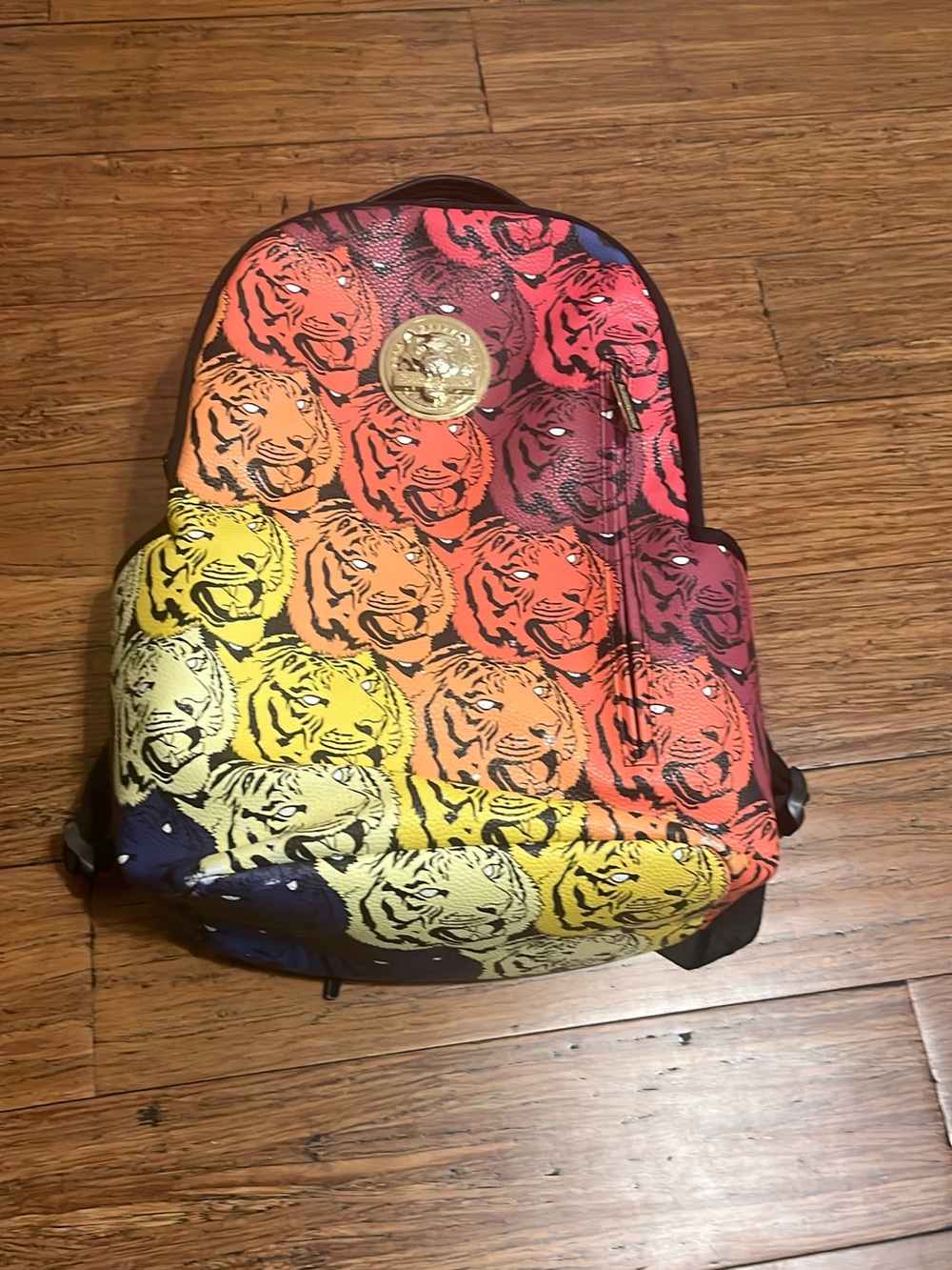 Sprayground Multicolor Tiger Print Backpack - Yellow, Orange, Red, Pink, Blue